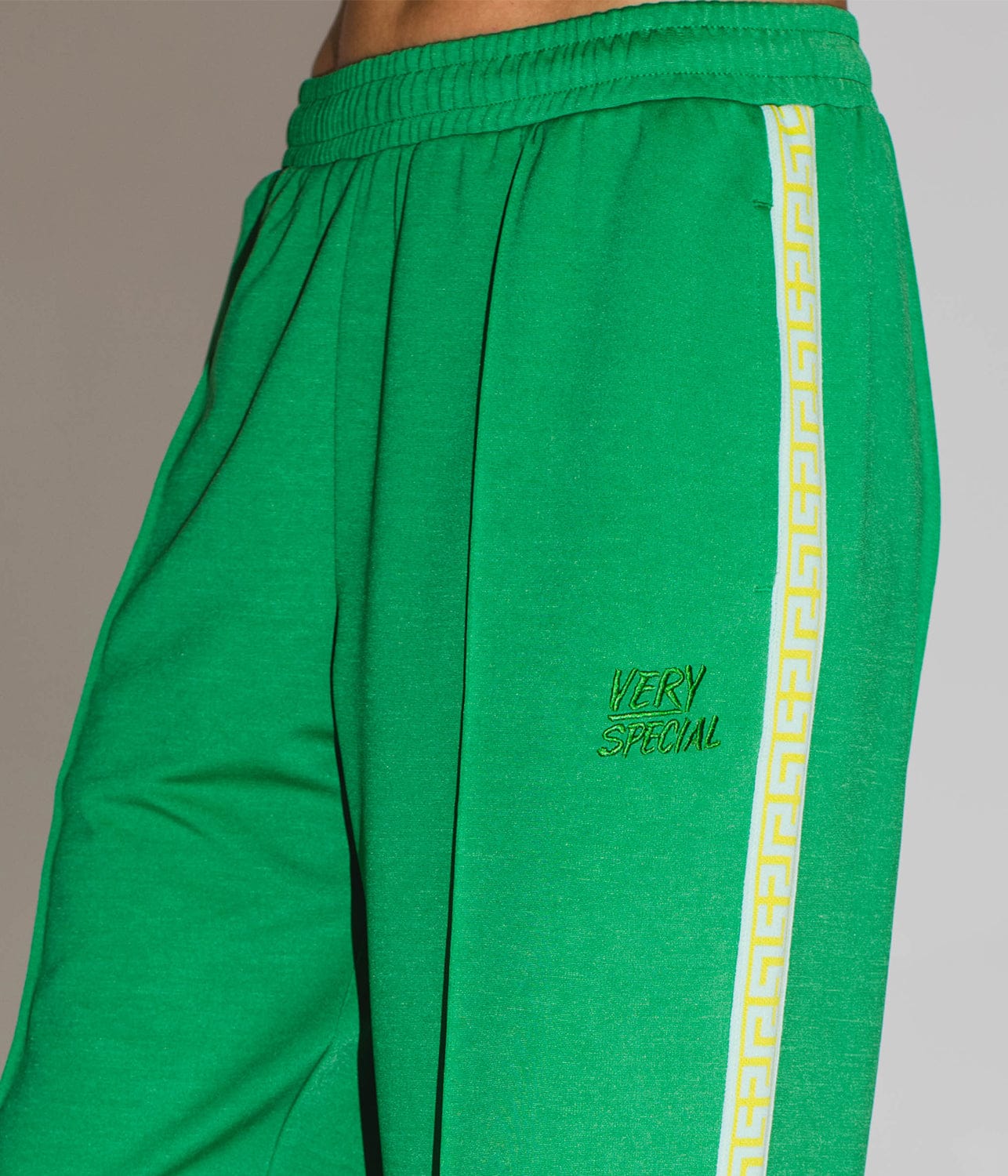 GEO TRACKPANTS- GREEN | SOMETHING VERY SPECIAL | SOMETHING VERY SPECIAL GEO TRACKPANTS- GREEN